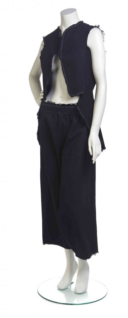 A Comme des Garcons Navy Cotton Pant Ensemble,: A Comme des Garcons Navy Cotton Pant Ensemble, comprised of a sleeveless vest, together with a pair of harem pants, both with white contrast stitching. Labeled: Comme des Garcons.