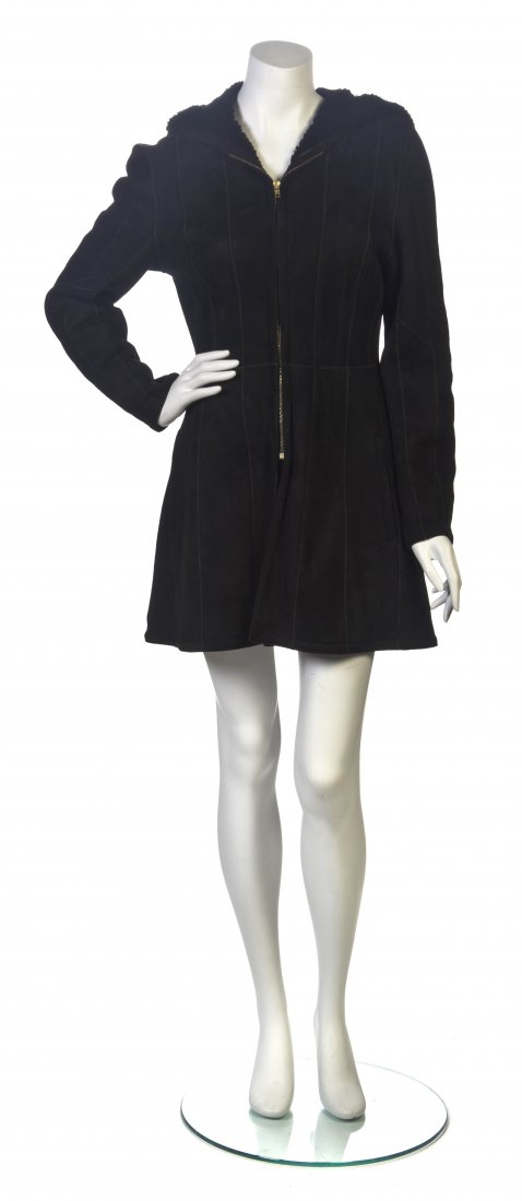 An Hermes Black Shearling Hooded Coat, Size 36.: An Hermes Black Shearling Hooded Coat, zipper front with two slash pockets and a center back split hem. Labeled: Hermes. Size 36.
