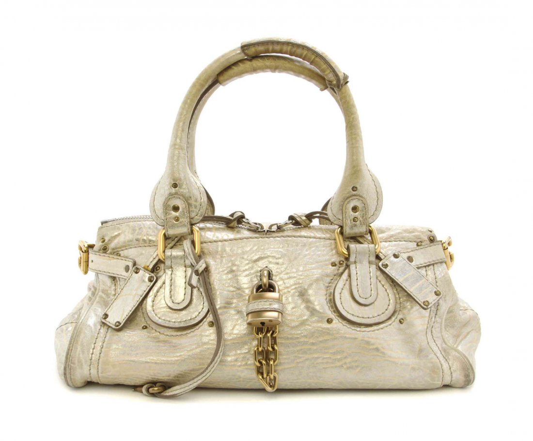 A Chloe Distressed Gold Metallic Leather Paddington: A Chloe Distressed Gold Metallic Leather Paddington Bag, two top handles, top zipper closure, beige fabric lining. Stamped: Chloe. 14 x 11 x 6 inches.