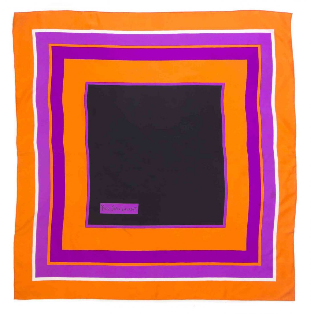 An Yves Saint Laurent Silk Print Scarf, 32 x 32 inches.: An Yves Saint Laurent Silk Print Scarf, in a multicolor square pattern. Labeled within print: Yves Saint Laurent. 32 x 32 inches.
