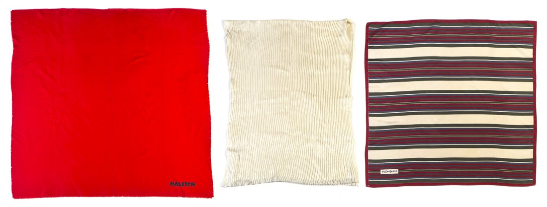 A Pair of Yves Saint Laurent Silk Scarves,: A Pair of Yves Saint Laurent Silk Scarves, comprised of an ivory jacquard pleated scarf, a multicolor stripe print scarf, together with a Halston red silk scarf. Each labeled accordingly. Property fr