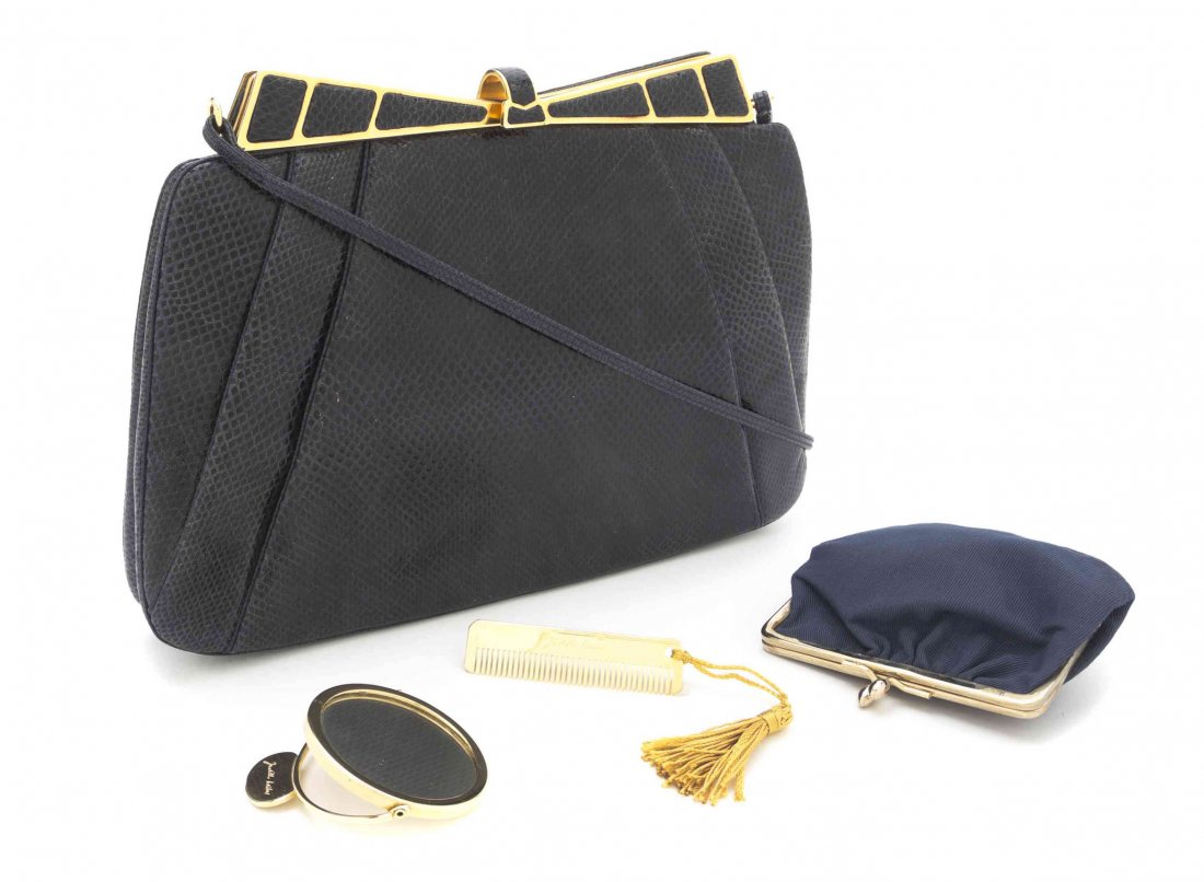 A Judith Leiber Navy Karung Snakeskin Bag, 11 1/2 x 8 x: A Judith Leiber Navy Karung Snakeskin Bag, goldtone frame, clasp closure, drop-in shoulder strap, with interior scalloped slip and zippered pockets, and a coin purse, comb, and mirror. Stamped: Judith