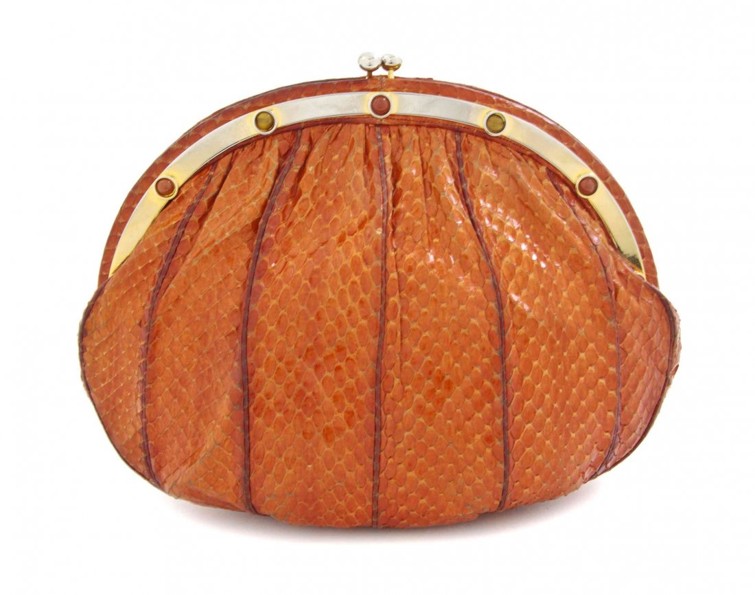 A Judith Leiber Orange Karung Snakeskin Bag, 9 1/2 x 7: A Judith Leiber Orange Karung Snakeskin Bag, circular goldtone semiprecious encrusted frame and coin purse clasp closure, drop-in shoulder strap, interior scalloped slip and zippered pockets. Stamped:
