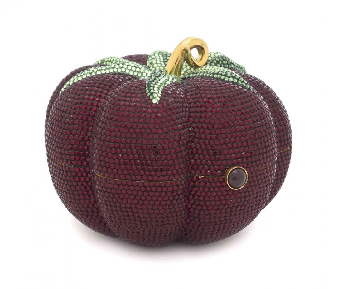 A Judith Leiber Crimson and Green Crystal Tomato: A Judith Leiber Crimson and Green Crystal Tomato Minaudiere, drop in goldtone chain strap, gold kid leather lining and all accessories. Stamped: Judith Leiber. Diameter 4 1/2 inches. Property of a Lad