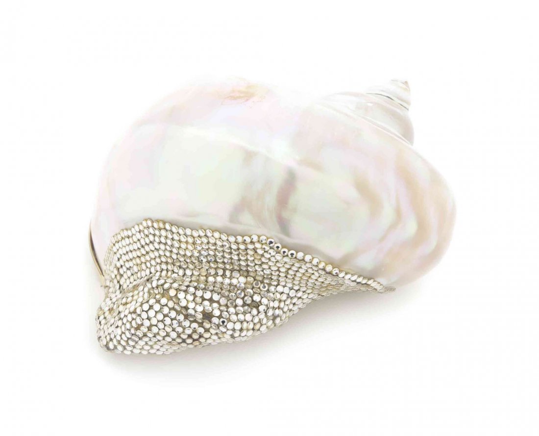 A Judith Leiber Shell Minaudiere, 6 x 4 1/2 inches.: A Judith Leiber Shell Minaudiere, mother of pearl seashell with silver Swarovski crystals and gold-plated lid. Stamped: Judith Leiber. 6 x 4 1/2 inches.