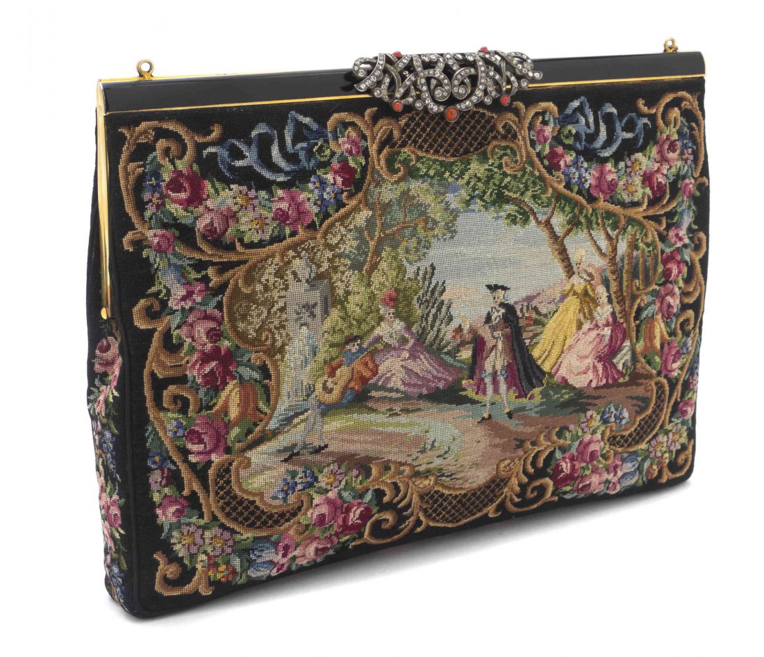 A Lucienne Offenthal Petit Point Evening Bag, 10 x 6: A Lucienne Offenthal Petit Point Evening Bag, depicting a scenic and figural scene, with a black enamel frame, a filigree engraved metal clasp with set in marcasite and five fire opal cabochons, two i