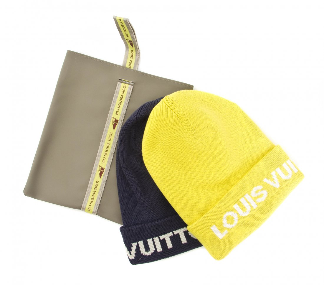 A Pair of Louis Vuitton Cup Cashmere Blend Knit Hats,: A Pair of Louis Vuitton Cup Cashmere Blend Knit Hats, comprised of a yellow and steel grey hat. Labeled: Louis Vuitton. Size OS.