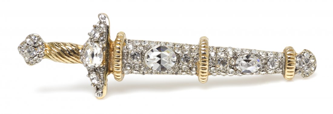 A Kenneth Jay Lane Goldtone Rhinestone Brooch,: A Kenneth Jay Lane Goldtone Rhinestone Brooch, in a sword shape. Stamped: Kenneth Lane.