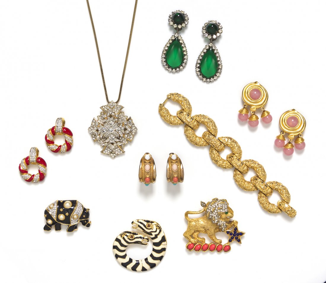 A Group of Kenneth Jay Lane Costume Jewelry,: A Group of Kenneth Jay Lane Costume Jewelry, comprised of three brooches, four pairs of earclips, a chunky link bracelet and a pendant necklace. All stamped. Property from an Important Collector, Chic