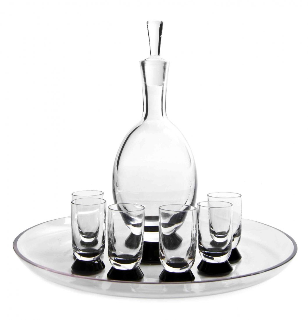 A Swedish Art Deco Style Glass Cocktail Service,: A Swedish Art Deco Style Glass Cocktail Service, Orrefors, comprising a decanter, six cordials; together with an under tray of circular form. Height of first 9 inches.