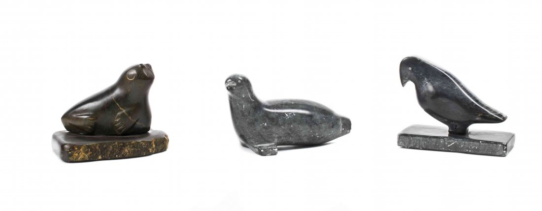 Three Inuit Carved Animal Figures, Height of tallest 4: Three Inuit Carved Animal Figures, 20th century, two hardstone, one a seal, the other a bird, both signed Andy Que, the third a seal in hardstone or fossilized material, signed Limac and dated 1977. H
