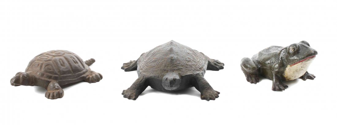 Three Cast Iron Animal Form Doorstops, Length of: Three Cast Iron Animal Form Doorstops, comprising two turtles and a cold-painted frog. Length of longest 9 inches.