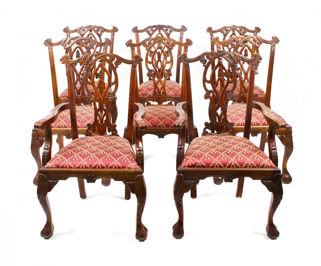 A Set of Eight George III Chippendale Style Dining: A Set of Eight George III Chippendale Style Dining Chairs, comprising two armchairs and six side chairs, having a foliate carved crest rail over an openworked splat above trapezoidal drop-in seat, rai