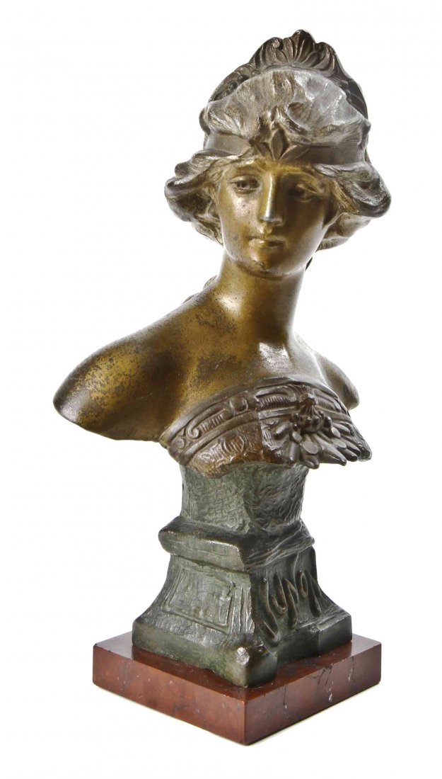 A Patinated and Cold-painted Spelter Bust of Juno,: A Patinated and Cold-painted Spelter Bust of Juno, early 20th century, P. Rigual, titled on socle "Junon," on rouge marble base. Height 8 3/4 inches.