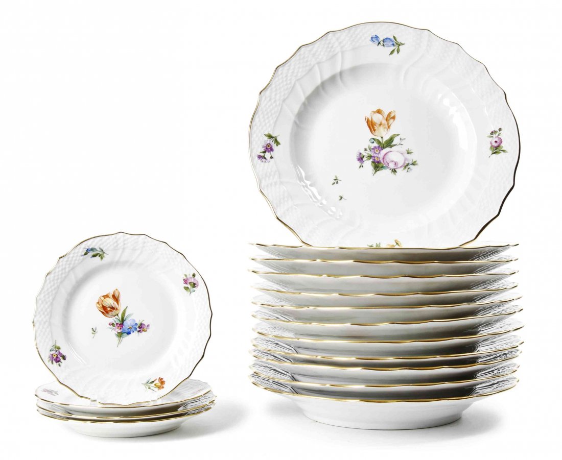 A Royal Copenhagen Porcelain Partial Dinner Service,: A Royal Copenhagen Porcelain Partial Dinner Service, painted with scattered flower stems, with ozier molded and shaped rim with gilt edge, comprising 12 dinner plates and 4 bread plates; 16 items tota