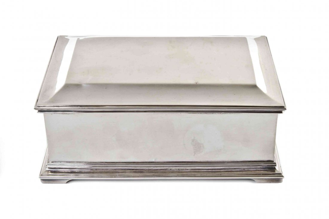 A George V Silver Cigarette Box, Crichton & Co.,: A George V Silver Cigarette Box, Crichton & Co., London, 1930, rectangular, with hinged lid enclosing wood-lined interior; 17 ozt 18 dwt gross. Height 2 3/8 x width 6 x depth 4 inches.