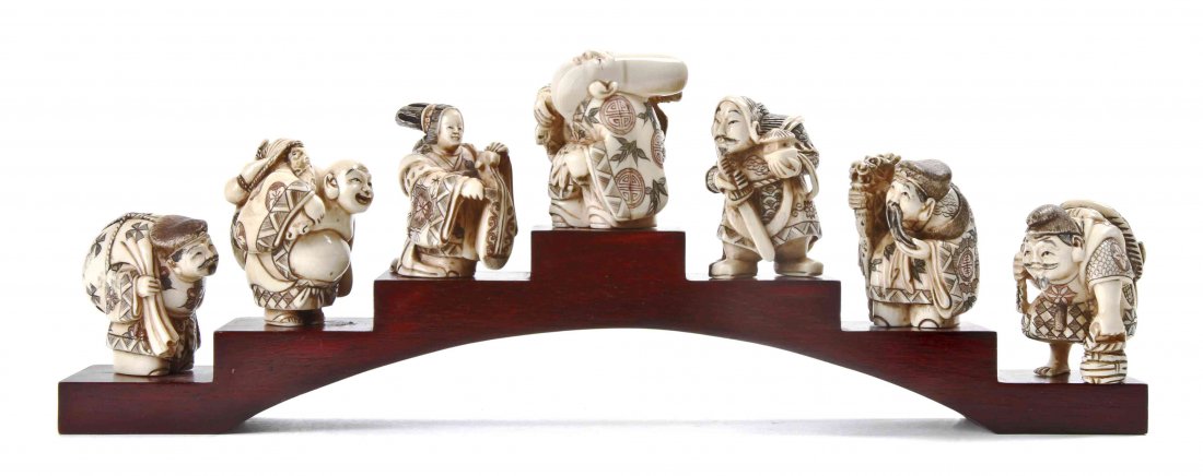 Collection of Seven Japanese Ivory Netsukes, Height of: Collection of Seven Japanese Ivory Netsukes, 20th century, each carved as a small human figure at varying pursuits. Height of tallest 1 7/8 inches.