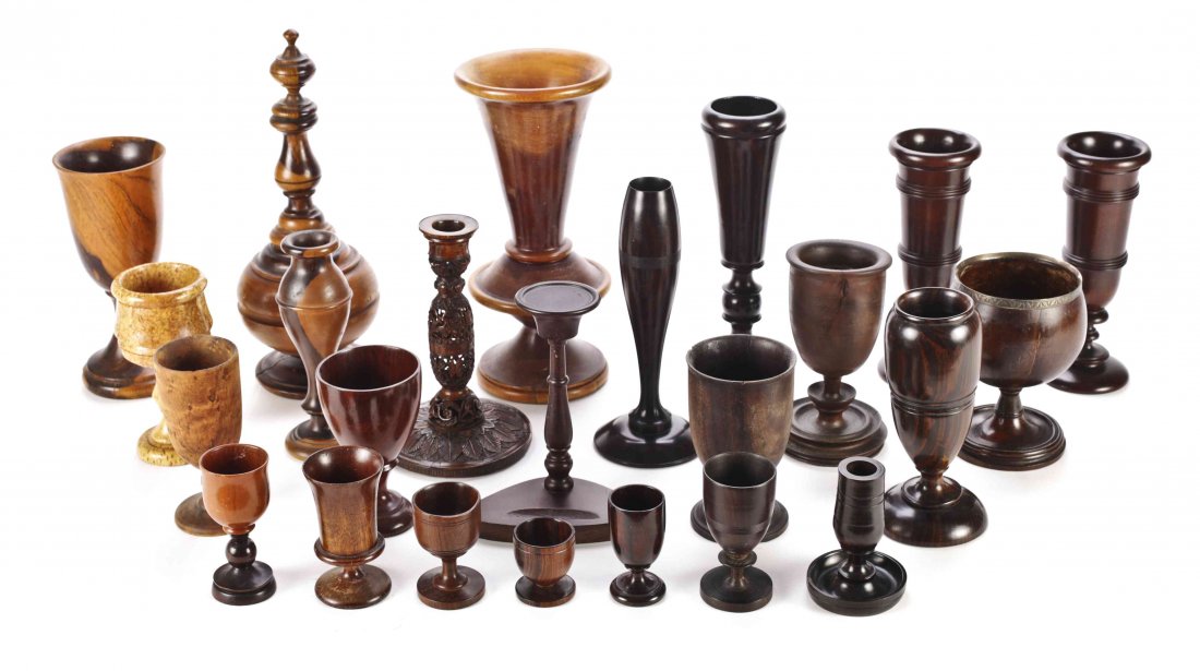 A Collection of Twenty-Five Treenware Vases, Egg Cups: A Collection of Twenty-Five Treenware Vases, Egg Cups and Candlesticks, various sizes and shapes. Height of tallest 12 inches. Property from a Distinguished Private Collection, Chicago and Palm Beach