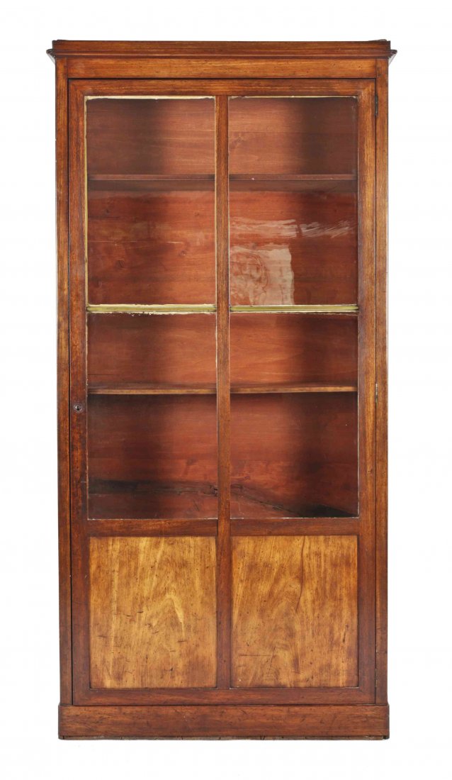 A Continental Walnut Bibliotheque Cabinet, Height 71 x: A Continental Walnut Bibliotheque Cabinet, rectangular cornice and case, with glass door enclosing shelves. Height 71 x width 35 x depth 12 inches. Property of a Palm Beach Estate