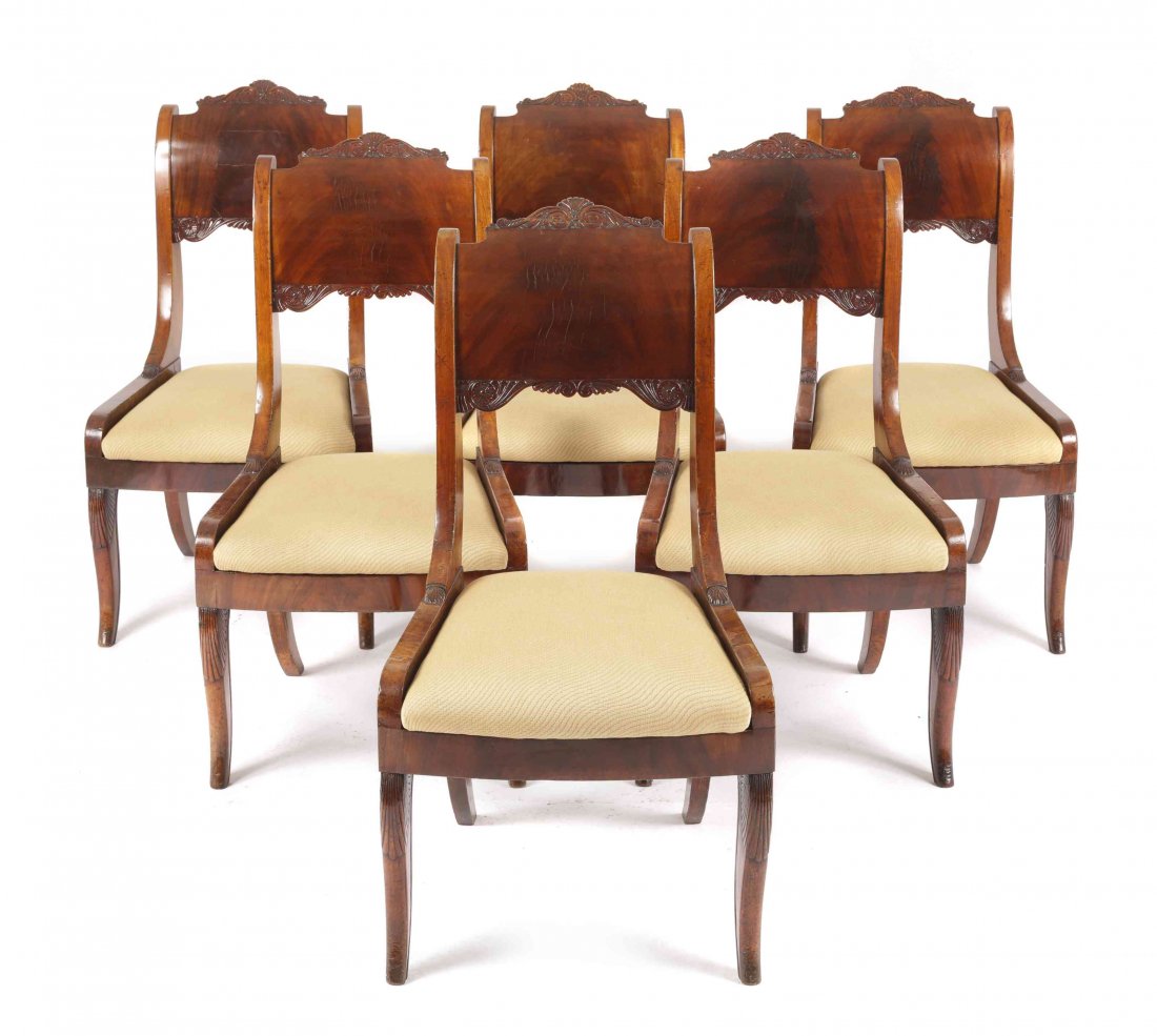Six Biedermeier Flame Mahogany Side Chairs, Height 37: Six Biedermeier Flame Mahogany Side Chairs, second half of 19th century, each having a rectangular back splat with scroll carved crest rail, over a drop in cushion seat, raised on rear sabre legs and 