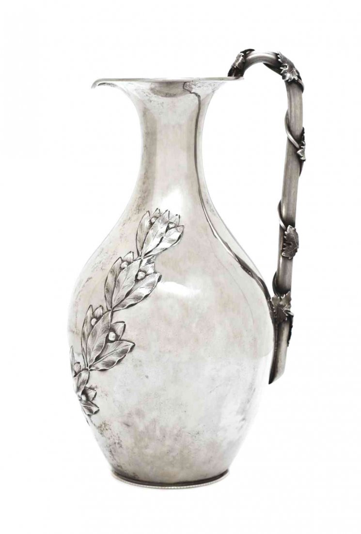 An American Silver Ewer, William Gale & Son, New York,: An American Silver Ewer, William Gale & Son, New York, NY, Mid-Late 19th Century, the baluster body chased with a laurel bough, the angular handle wrapped with ivy, monogrammed; 14 ozt 4 dwt. Height 8