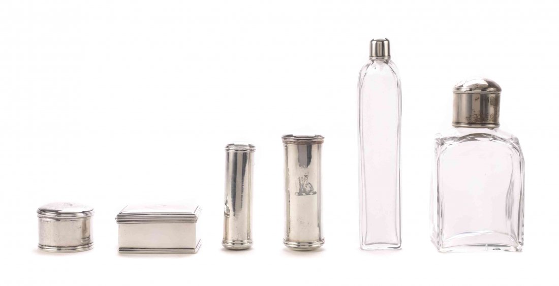 An Assembled George III Silver Vanity Set, London,: An Assembled George III Silver Vanity Set, London, Circa 1765, comprising three small round jars, a small rectangular box, three cylindrical boxes, a nutmeg grater, two flattened ovoid glass perfume f