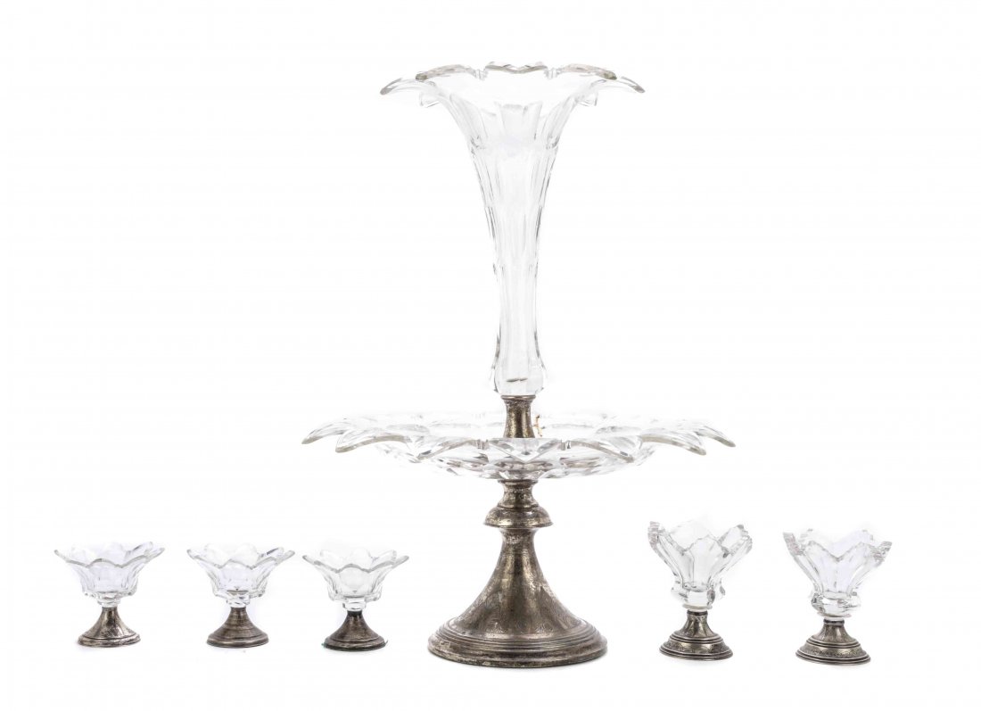 A Dutch Silver and Colorless Cut Glass Epergne, Height: A Dutch Silver and Colorless Cut Glass Epergne, mid to late 19th century, with acanthus and scroll engraved weighted trumpet foot, mounted with a colorless glass plate and trumpet-shaped vase, both wi