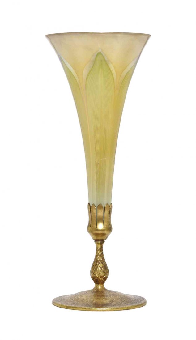 A Tiffany Studios Dore Bronze and Favrile Glass Trumpet: A Tiffany Studios Dore Bronze and Favrile Glass Trumpet Vase, the vase of tapering form with pulled feather decoration, over a baluster standard, ending with a circular foot, stamped Tiffany Studios N