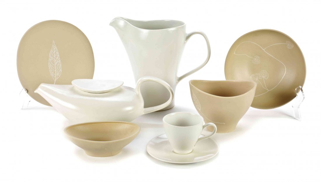 A Collection of Russel Wright Esquire Ceramic Table: A Collection of Russel Wright Esquire Ceramic Table Articles, comprising bowls, plates, a teapot, pitchers, platters, serving bowls, and various serving plates and dishes, each with a white or tan gro