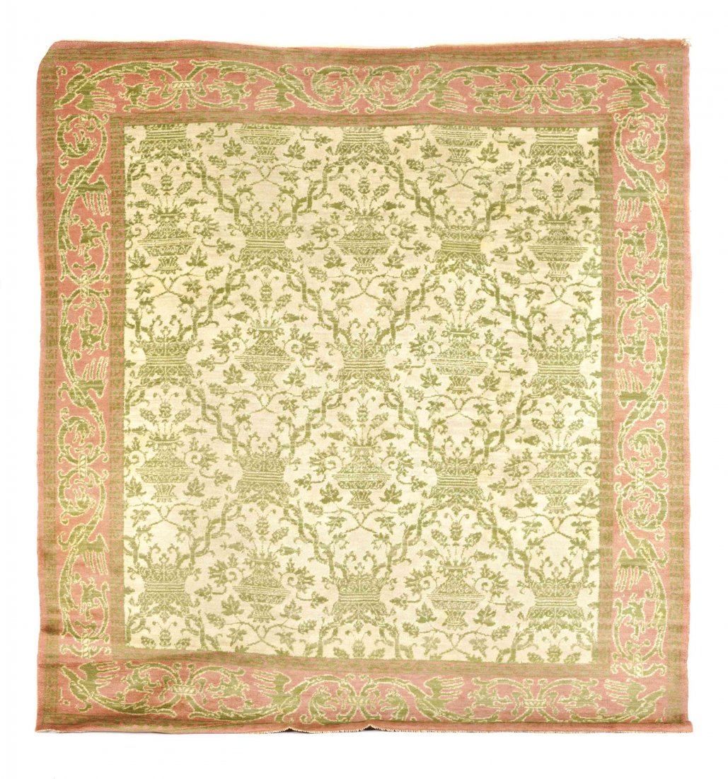 A Spanish Wool Rug, Length 104-3/4 x width 96-1/2: A Spanish Wool Rug, with central green urn and trellis design on cream ground, in green vine border with pink ground, bearing "Fundacion Generalisimo Franco" label. Length 104-3/4 x width 96-1/2 inche