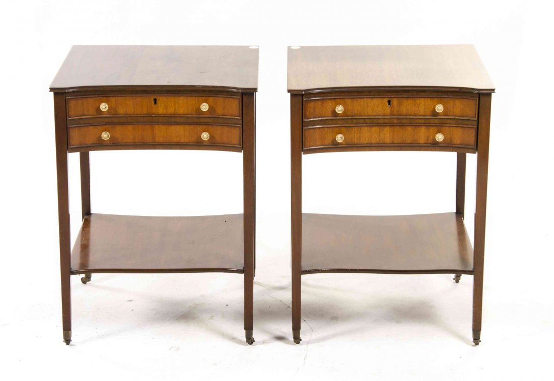 A Pair of Sheraton Style Mahogany Night Stands, Height: A Pair of Sheraton Style Mahogany Night Stands, each top with a concave front, raised on tapering legs joined by a medial shelf. Height 26 x width 19 x depth 18 inches. Property from the Estate of Vir