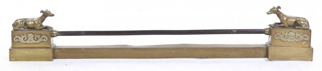A Brass and Steel Fireguard, Width 47 inches.: A Brass and Steel Fireguard, of low form, each end set with a seated hound, with further applied scrolling decoration. Width 47 inches. Property from the Estate of Mr. and Mrs. Saul Brand, Chicago, Il