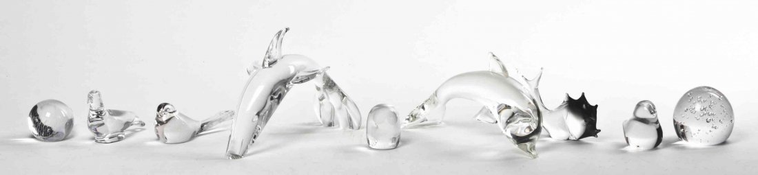 A Collection of Nine Glass Figurines, Width of widest 9: A Collection of Nine Glass Figurines, including examples by Baccarat, Costa, Daum, Steuben, together with a controlled air bubble paperweight. Width of widest 9 1/2 inches. Property from the Estate of