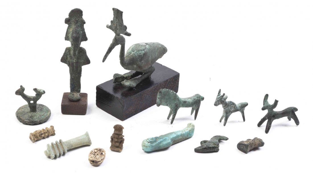 A Group of Eight Bronze Antiquities, Height of tallest: A Group of Eight Bronze Antiquities, together with five ceramic antiquity articles, Egyptian. Height of tallest 3 inches. Property from the Estate of William A. Scott, Kansas City, Missouri