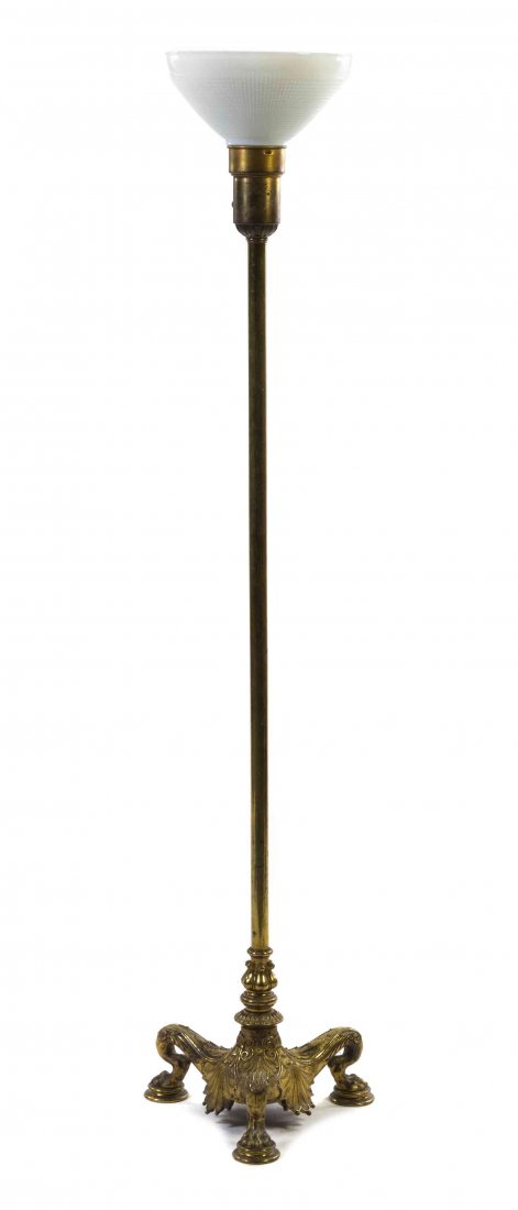 A Neoclassical Style Gilt Bronze Floor Lamp, Height: A Neoclassical Style Gilt Bronze Floor Lamp, having a cylindrical standard supporting the lighting element and raised on a tripartite base, cast with palmette decoration and paw feet. Height overall 5
