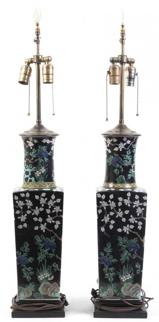 A Pair of Chinese Famille Noir Porcelain Vases, Height: A Pair of Chinese Famille Noir Porcelain Vases, having a cylindrical neck over the tapering square bodies, fitted as lamps. Height of vases 19 inches. Property from the Estate of Virginia H. Rogers, C