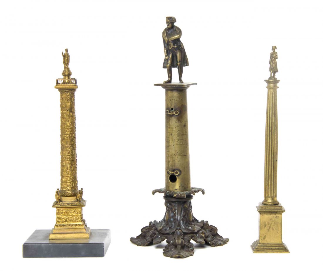 Three Bronze or Gilt Metal Napoleonic Architectural: Three Bronze or Gilt Metal Napoleonic Architectural Models, each depicting a column supporting a figure, one formerly containing a thermometer. Height of tallest 9 1/4 inches. Property from the Ann St