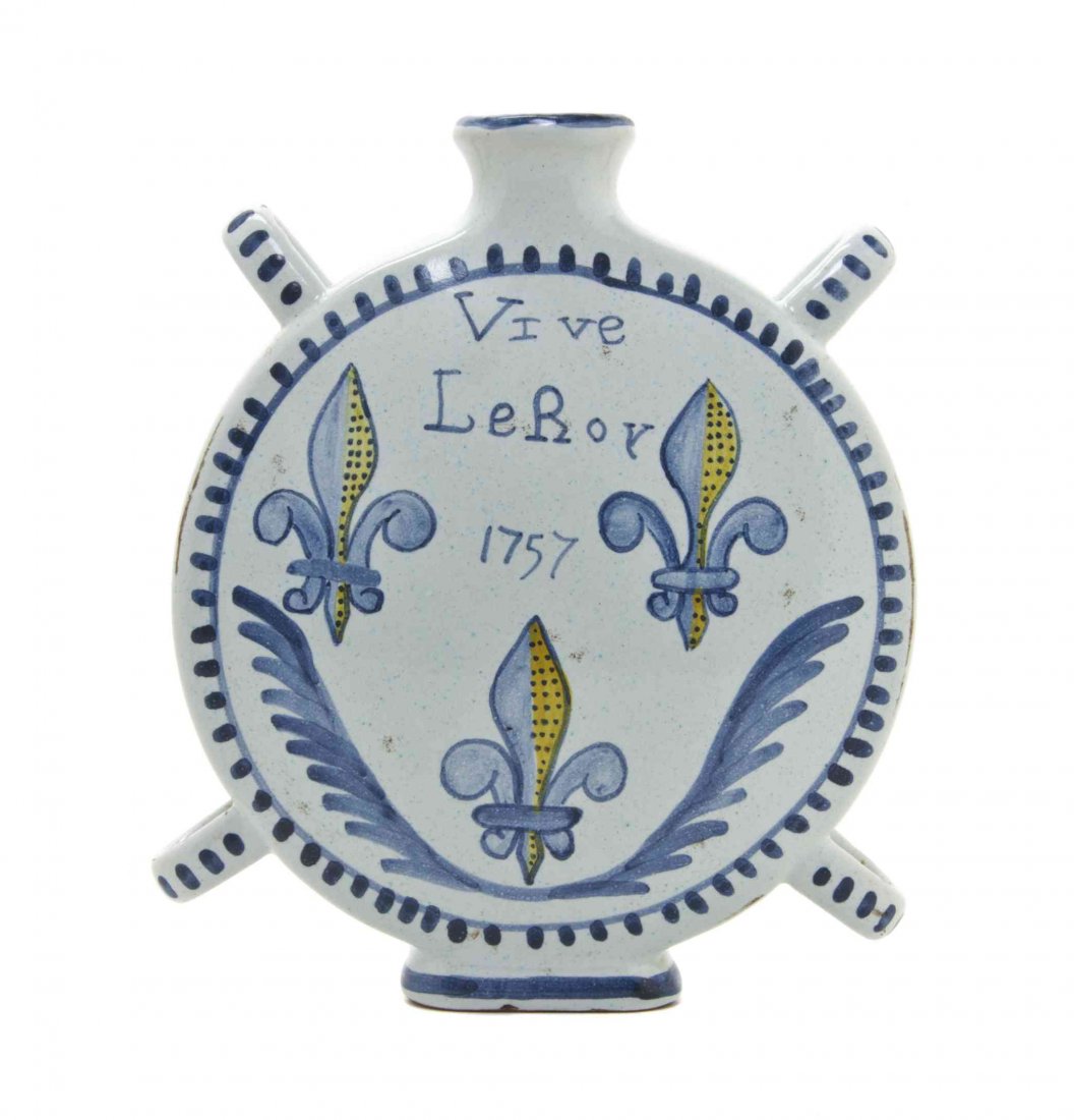 A French Faience Moon Flask, Height 8 1/2 inches.: A French Faience Moon Flask, decorated to show fleurs-de-lis and inscribed "Vive le Roy." Height 8 1/2 inches.