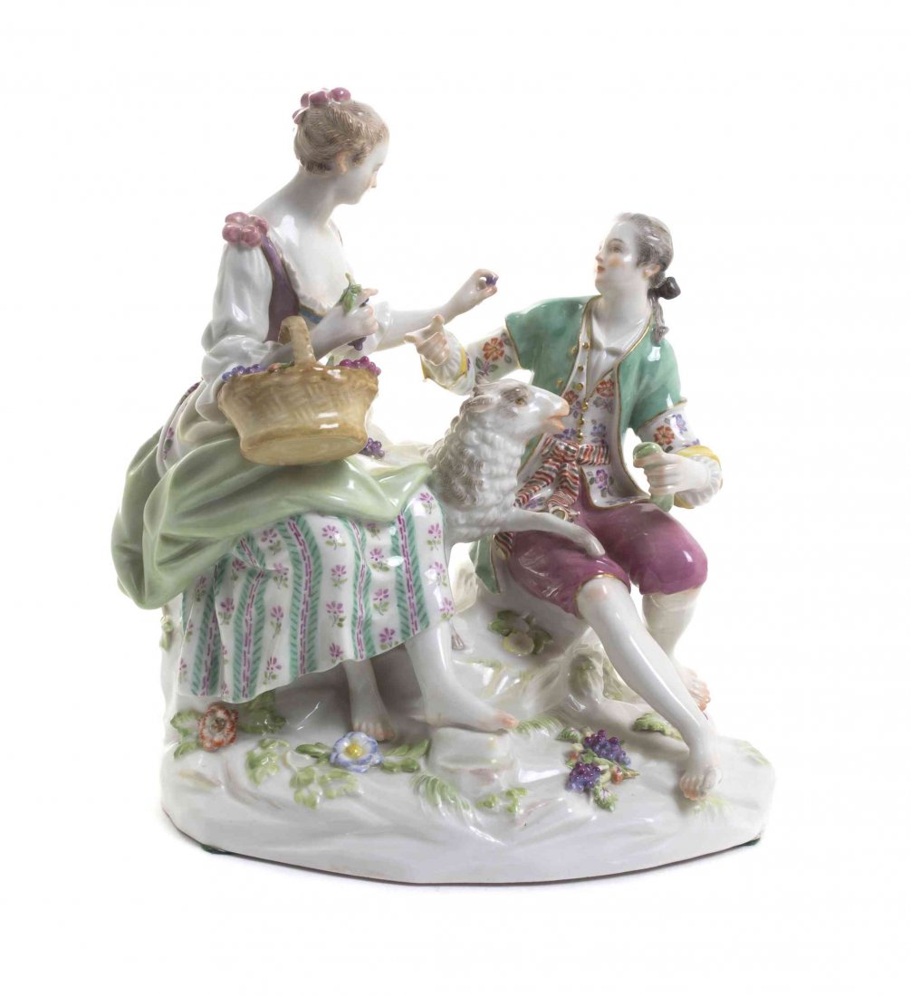A Meissen Porcelain Figural Group, Height 8 inches.: A Meissen Porcelain Figural Group, depicting a courting couple with sheep, having crossed swords in underglaze blue, incised 10, impressed C41A. Height 8 inches. Property from the Collection of Mr. an
