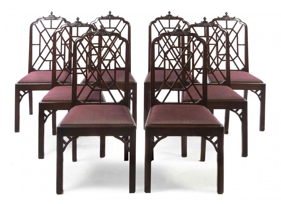 A Chinese Chippendale Style Mahogany Dining Suite, Yale: A Chinese Chippendale Style Mahogany Dining Suite, Yale R. Burge, comprising an extension table and eight chairs, the chairs each with a cupola crest above a pierced fret carved back and trapezoidal u