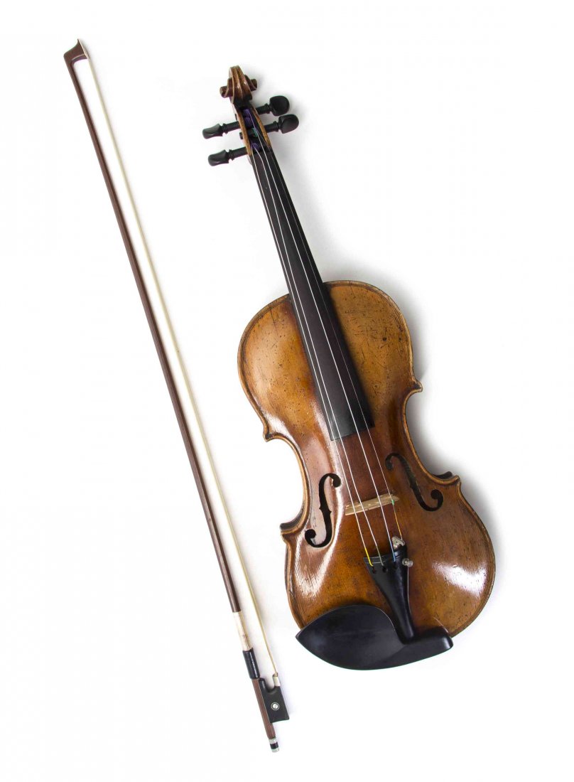 A Full Sized Violin and Bow, Length of violin back 14: A Full Sized Violin and Bow, the violin in the style of Lupot and bearing a label marked Lupot, with a full-sized violin bow marked Jos. Martin, in a fitted case. Length of violin back 14 inches. Prov