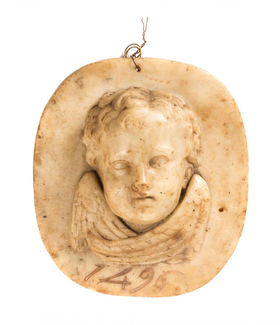 A Italian Carved Alabaster Roundel, Diameter 9 1/2: A Italian Carved Alabaster Roundel, centered with a cherub's face, inscribed 1496. Diameter 9 1/2 inches. Property from the Collection of Ms. Clementine Quandt, Rockford, Illinois