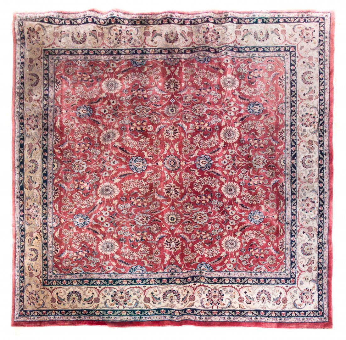 A Persian Wool Rug, 8 feet 3 inches x 8 feet 1/2 inch.: A Persian Wool Rug, having an allover foliate and floral design on a red ground within multiple borders. 8 feet 3 inches x 8 feet 1/2 inch. Property from the Estate of Louis M. and Linda M. Byron, Tuc