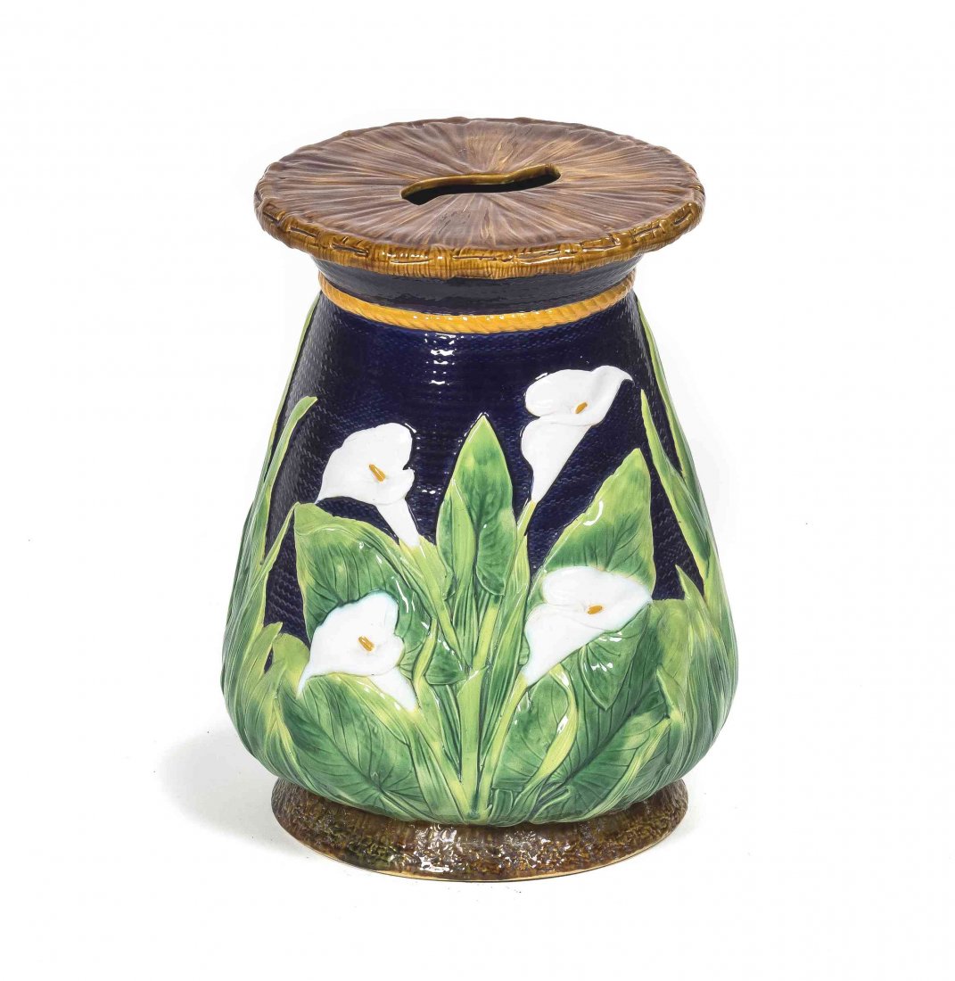 A Majolica Garden Seat, Height 18 inches.: A Majolica Garden Seat, of ovoid form decorated with calla lillies on a blue ground. Height 18 inches.