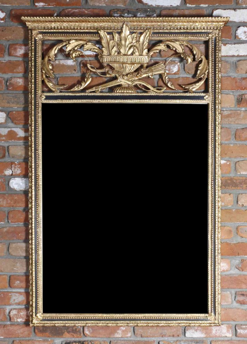 A Louis XVI Style Gilt and Black Lacquered Over Mantel: A Louis XVI Style Gilt and Black Lacquered Over Mantel Mirror, having a rectangular mirror plate within a conforming frame worked to show foliate scrolls, urn forms and a bow with quiver of arrows. He