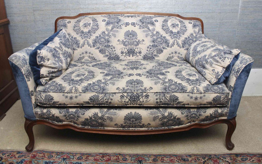 A Pair of Louis XV Style Fruitwood Settees, Width 58: A Pair of Louis XV Style Fruitwood Settees, each having shaped crest rail over the upholstered back arms and seats raised on cabriole legs. Width 58 inches.