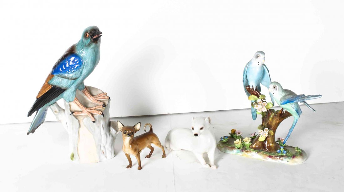 A Collection of Four Porcelain Animal Figures, Height: A Collection of Four Porcelain Animal Figures, comprising a Dresden model of a bird, a German figure of a chihuahua, a Staffordshire figural group of two birds, and a Nymphenburg albino mink. Height o