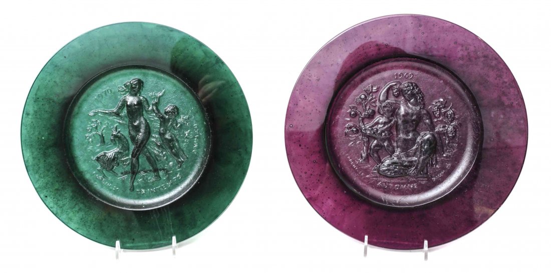 Four Daum Pate de Verre Annual Plates, Diameter of each: Four Daum Pate de Verre Annual Plates, each in a different color decorated with classical figures. Diameter of each 10 1/2 inches.