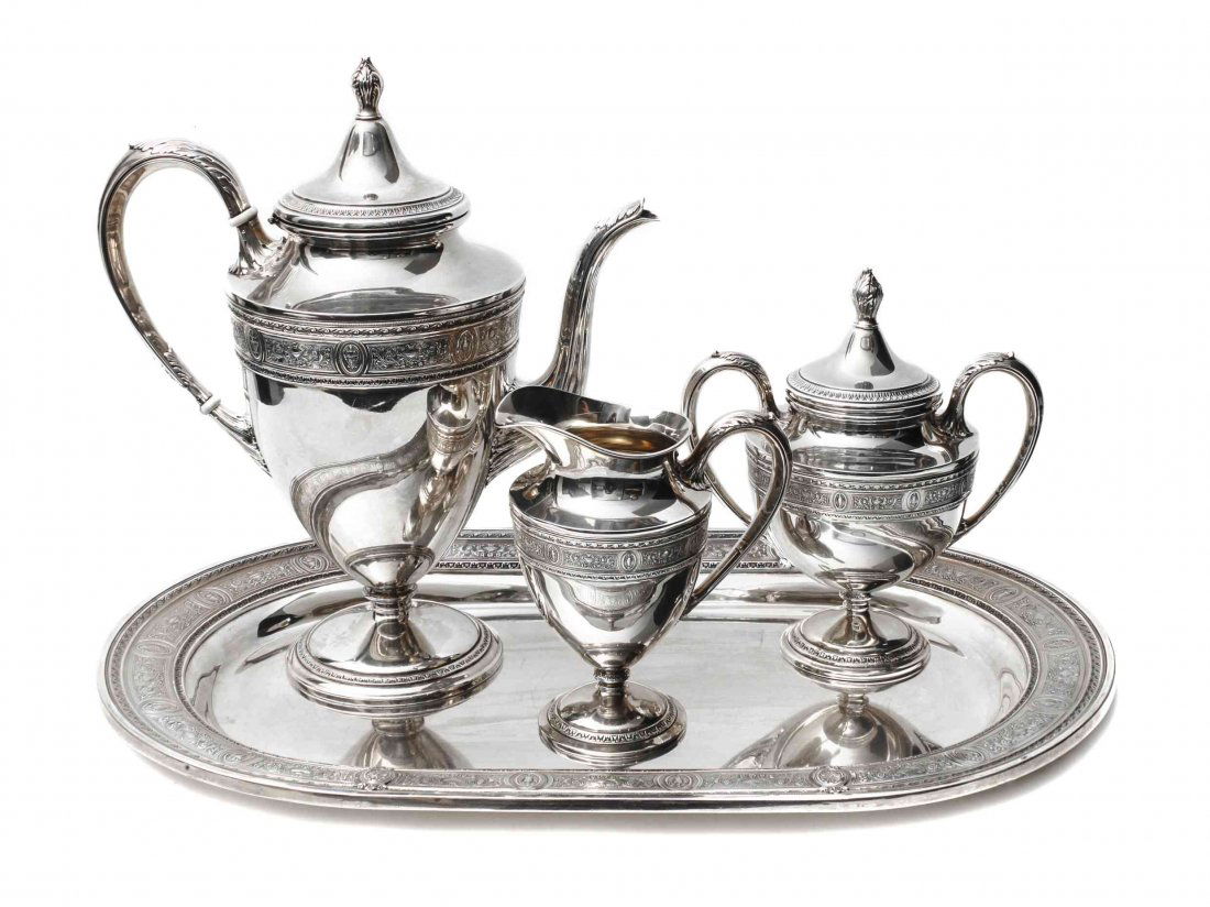 An American Silver Tea Set, International Silver Co.,: An American Silver Tea Set, International Silver Co., Meriden, CT, Wedgwood pattern, comprising a teapot, covered sugar, creamer, oval tray, the teapot with ivory insulators. Approximate total weight