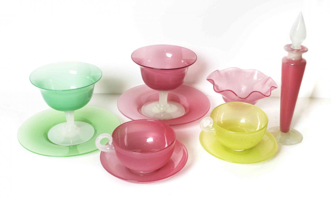 A Collection of Steuben and Stevens and Williams: A Collection of Steuben and Stevens and Williams Monochrome Glass Articles, comprising two teacups and two saucers, two sorbets and underplates, a perfume and ruffled compote. Height of tallest 7 3/4 
